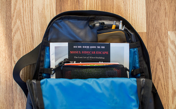 a Small Ghost Whale Pouch in the main compartment of a Daylight Backpack.